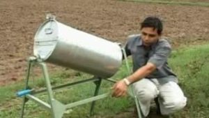 Farmer with Seed Treatment Drum