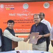 AP Food Processing Society CEO L. Sridhar Reddy and Bank of Baroda DGM Chandan Sahoo at the signing of an MoU for expansion of solar dehydration units, in Vijayawada on Monday